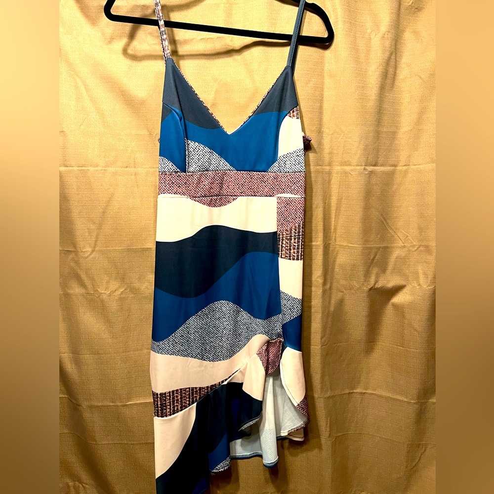 Size L casual dress. Thin straps, v-neck, asymmetrical flutter hem, thigh slit.